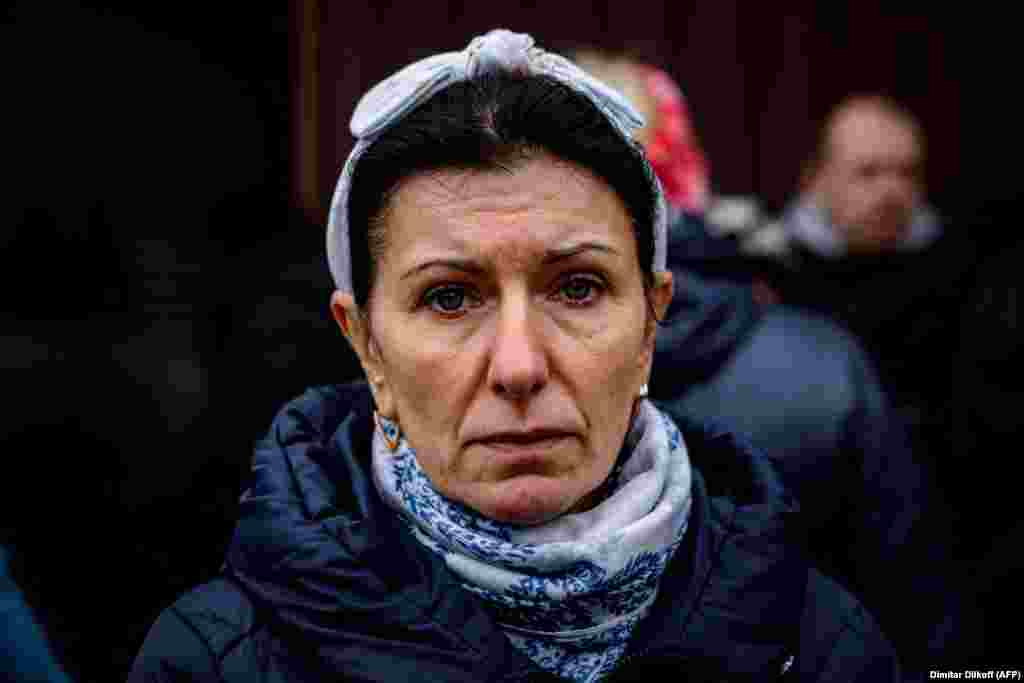 Inna Kupriyanov, a factory worker, waits to submit her DNA for the identification of her father in Izyum. Ukraine has sent several groups of investigators to the Kharkiv region. Prosecutor-General Andriy Kostin announced the teams would be &quot;inspecting destroyed infrastructure, and with facts of murders of local residents.&quot;