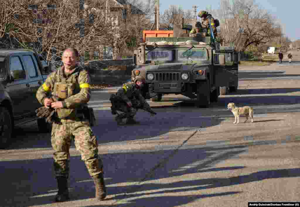 Ukrainian forces on a street in Snihurivka &quot;People offered warm food to the military&quot; as soldiers entered the town, Dubchak said. &quot;I saw soldiers crying, too.&quot;&nbsp; &nbsp;