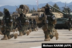 Newly recruited personnel joining the Taliban security forces demonstrate their skills during their graduation ceremony in the western city of Herat in February.