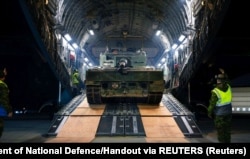 The first of four Leopard 2 tanks that Canada is handing over to Ukraine is delivered to Poland on February 5.