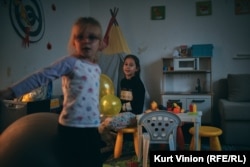 Eva and Kyra, 8, play at the after-school child-care center sponsored by an Israeli-based NGO in Prague on November 15.