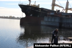 A man taking water from the Dnieper River