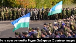 Troops mobilized from Bashkortostan (flying flags of the region) gather at their place of deployment in the Saratov region in October.