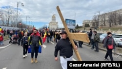 Protesters attend a rally organized by Calin Georgescu's supporters in front of Bucharest's Palace of Parliament on January 10