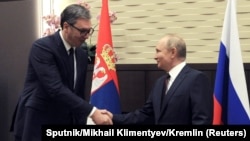 Russian President Vladimir Putin (right) shakes hands with Serbian counterpart Aleksandar Vucic in Sochi on November 25.