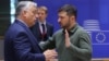 Hungarian Prime Minister Viktor Orban (left) talks with Ukrainian President Volodymyr Zelenskiy during the European Council Summit in Brussels on June 27.