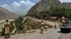 Pakistani soldiers patrol along a road in a northwestern district close to the Afghan border. (file photo) 