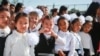 Students arrive for the first day of school in Bishkek on September 1.