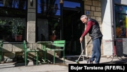 Nuredin Imeri at work near his cafe