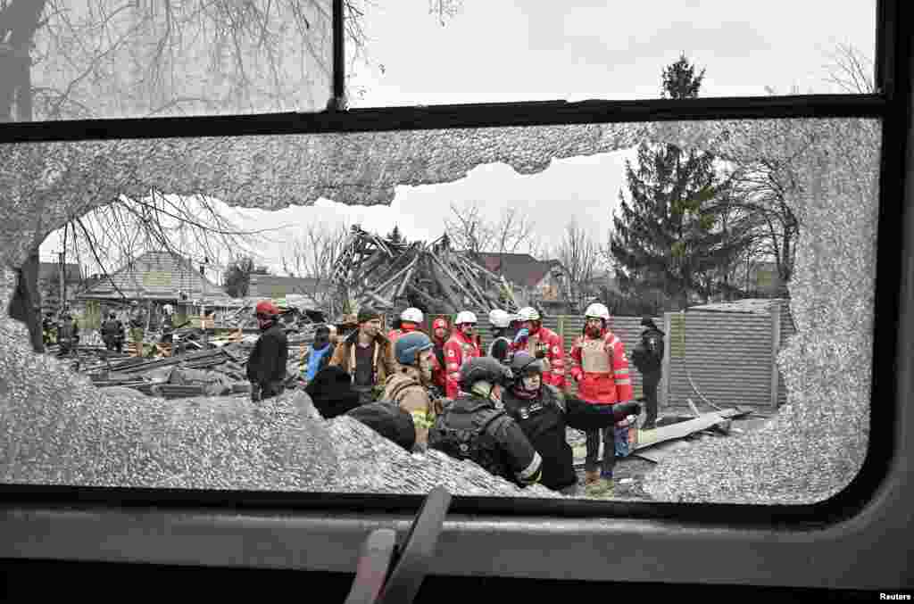 Rescuers work at the site of a Russian missile strike on Zaporizhzhya, in the southeastern part of Ukraine.