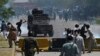 Supporters of former Pakistani Prime Minister Imran Khan clash with police during a protest in Islamabad on May 10, 2023. 