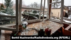 Jars of picked food and an abandoned armored vehicle in March 2022