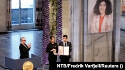 Kiana (center) and Ali Rahmani, Narges Mohammadi's children, accept the Nobel Peace Prize on behalf of their mother (upper right) in Oslo in December 2023.