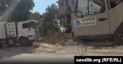 Trucks operating at the construction site of a new mosque near the Umarov-linked compound bear the logo of Hyper Partners, a company owned by Central Asian tycoon Khabibula Abdukadyr, who was revealed in previous RFE/RL investigations as the head of a smuggling and money-laundering syndicate.