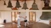 A boy being taught to ring church bells in the Lipovan village of Carcaliu on May 7