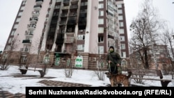 A charred apartment building in March 2022