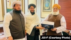 JUI leader Maulana Fazlur Rehman (right) visits Afghan diplomats in Peshawar, Pakistan on December 16, where he was invited to visit Kabul. 