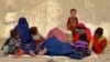 Afghan refugees rest upon their arrival from Pakistan at a registration center near the Afghan-Pakistani border in the Spin Boldak district of Kandahar Province on November 6.