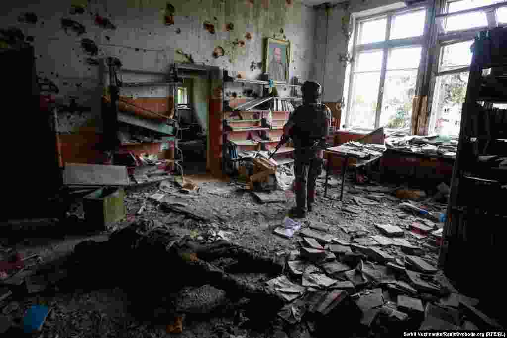 A Ukrainian soldier in a battle-damaged building in Blahodatne in the Donetsk Region on June 17, 2023.&nbsp;