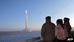 North Korean leader Kim Jong Un watches a test launch of an intercontinental ballistic missile in December.