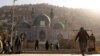 People walk around the Sakhi Shah-e Mardan Shrine in Kabul. The shrine is visited mainly by Hazaras, a Shi'ite community.
