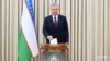 Uzbek President Shavkat Mirziyoev voting in the country's early presidential election in July 2023. 