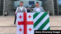 Mikheil Kvatashidze (left) and Daur Buava outside the European Parliament in Brussels