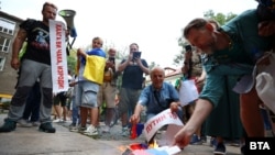 Protesters gather in solidarity with Mileva in front of the Russian cultural center in Sofia.