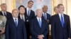 U.S. President Joe Biden (front center) and Hungarian Prime Minister Viktor Orban (back left) -- along with other European leaders -- attend a NATO event in Madrid in June 2022. Biden has excluded Orban from the list of invitees to his Summit for Democracy twice: in 2021 and this week.