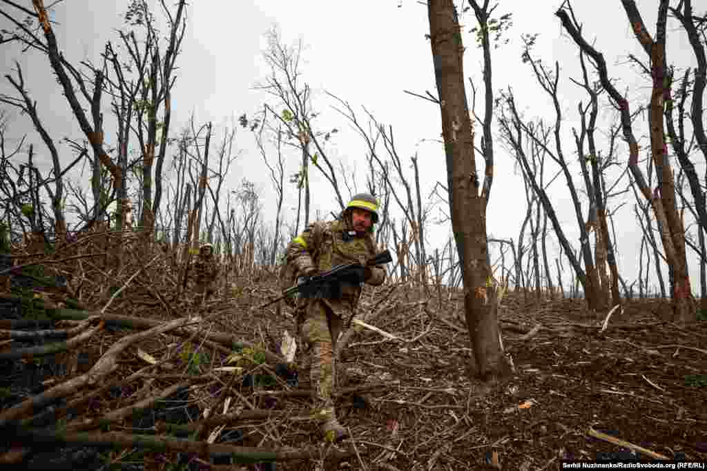 Ukrainian soldiers seen after the storming of a Russian position near Bakhmut in May 2023.&nbsp;