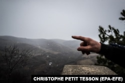 A villager points at a position of Azerbaijani troops in the Syunik region in January 2021.