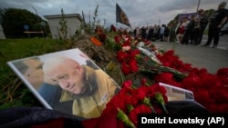 A portrait of Wagner Group owner Yevgeny Prigozhin is seen at an informal memorial in St. Petersburg on August 24 after his death.