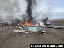 The burning remnants of a downed Sukhoi Su-35