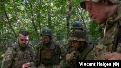 Recruits from 22nd Mechanized Brigade listen to their instructor during the training.