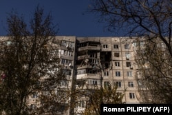 This photograph taken on October 29 shows a residential building heavily damaged during Russian attacks in the southern city of Kherson.