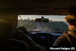 Soldiers from the Lyut Brigade drive their pickup truck in the direction of Chasiv Yar.