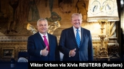 Hungarian Prime Minister Viktor Orban (left) meets Donald Trump at Trump's Mar-a-Lago home in Florida on July 11.