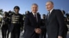 Uzbek President Shavkat Mirziyoev (left) welcomes Russian President Vladimir Putin at Tashkent's airport in May. 