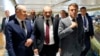 Armenian Prime Minister Nikol Pashinian (center) meets with German Chancellor Olaf Scholz (left) and French President Emmanuel Macron in Granada, Spain, on October 5.