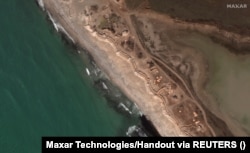 Anti-tank obstacles and trenches along a beach west of Yevpatoria, southwest Crimea, photographed on March 12.