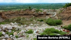 Cattle graze in an open pit near the village of Vrella.