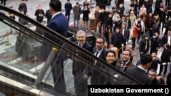 Dilyor Kayumov, a founding shareholder of Ultimo Group, escorts President Shavkat Mirziyoev (second left) during a March 5 visit to the Tashkent City Mall, where Kayumov currently serves as a senior manager.