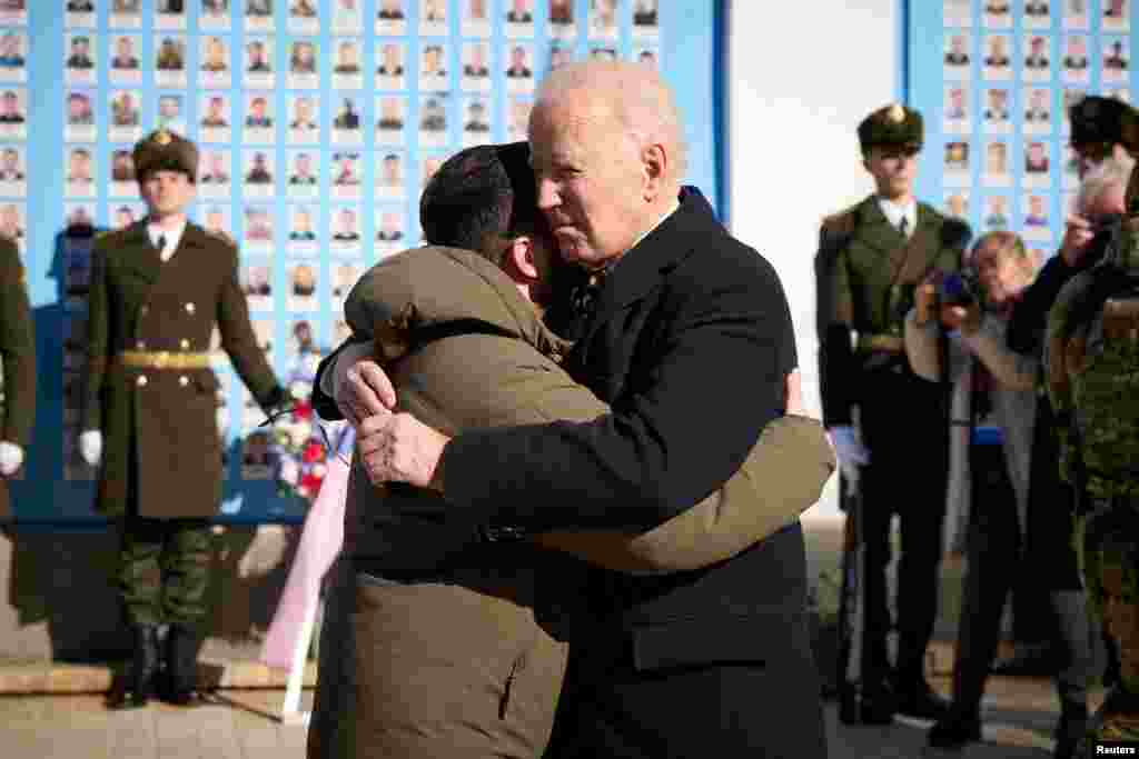 Biden embraces Zelenskiy as they visit the Wall of Remembrance in Kyiv to pay tribute to Ukrainian soldiers killed amid Russia&#39;s attack on Ukraine.