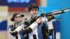 Alexandra Le (left) and Islam Satpayev have won Kazakhstan's first medal in a shooting event since 1996. 