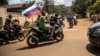 A motorcyclist in Burkina Faso holds the Russian flag, illustrating Moscow's influence in the country through its Africa Corps, the reconstituted Wagner Group. (file photo)