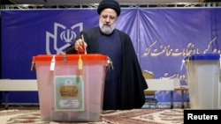 Iranian President Ebrahim Raisi casts his vote during parliamentary elections in Tehran on March 1. “The Islamic republic is now a minority-ruled unconstitutional theocracy,” one Iran expert says.