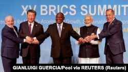 (Left to right) Brazilian President Luiz Inacio Lula da Silva, Chinese leader Xi Jinping, South African President Cyril Ramaphosa, Indian Prime Minister Narendra Modi, and Russian Foreign Minister Sergei Lavrov pose for a photo at the 2023 BRICS Summit in South Africa.