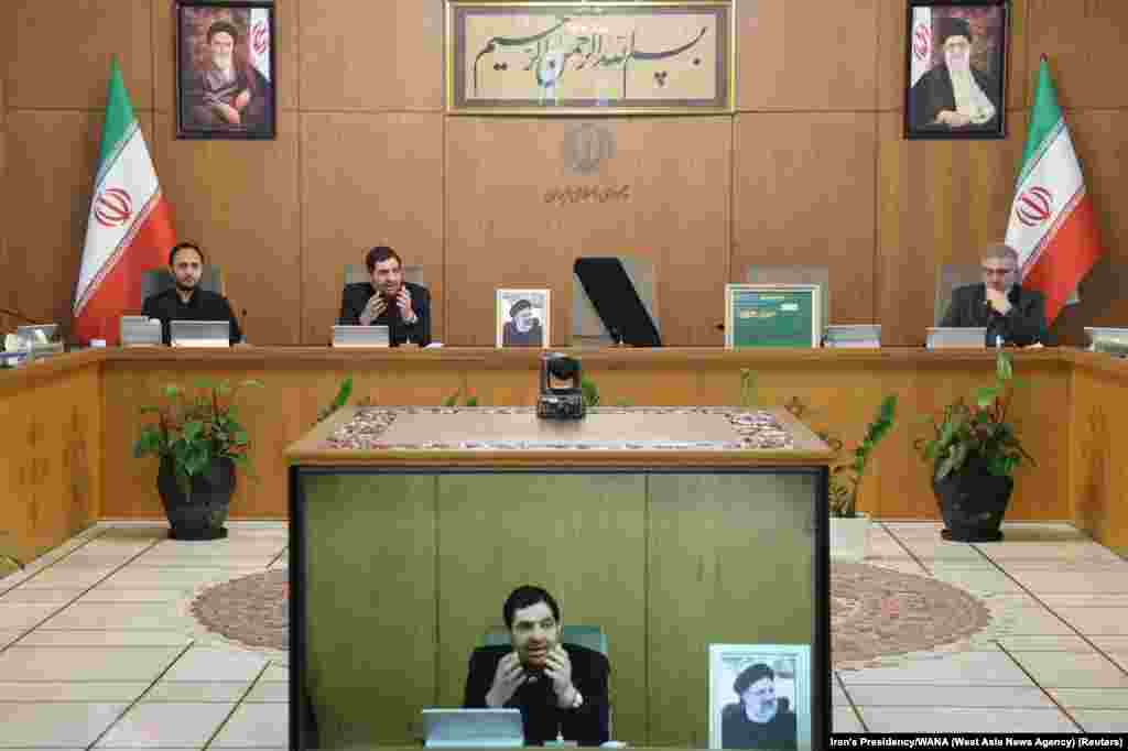 First Vice President Mohammad Mokhber speaks during a government cabinet meeting in Tehran on May 20 next to an empty chair, draped in a black fabric, where Raisi normally sat. Khamenei has named Mokhber interim president.&nbsp;