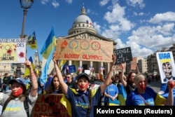 Ukrainians hold a rally in Paris on July 13 to commemorate the hundreds of Ukrainian athletes who have been killed in the Russian invasion.