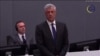 Former Kosovar President Hashim Thaci pleads not guilty to war crimes charges on the first day of his trial in The Hague on April 3.